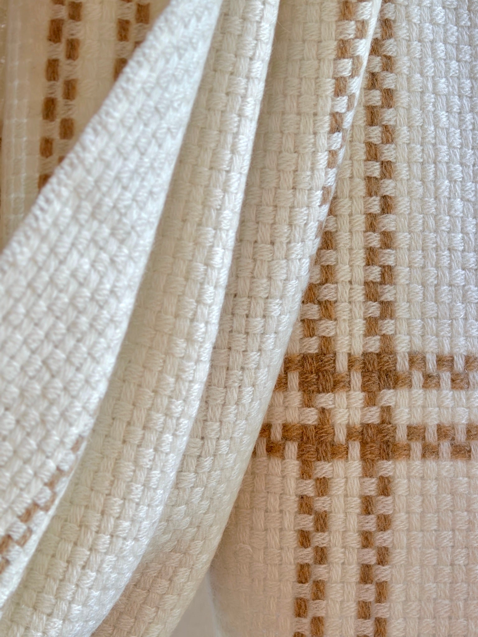 Close-up of woven cashmere with a focus on texture and pattern.