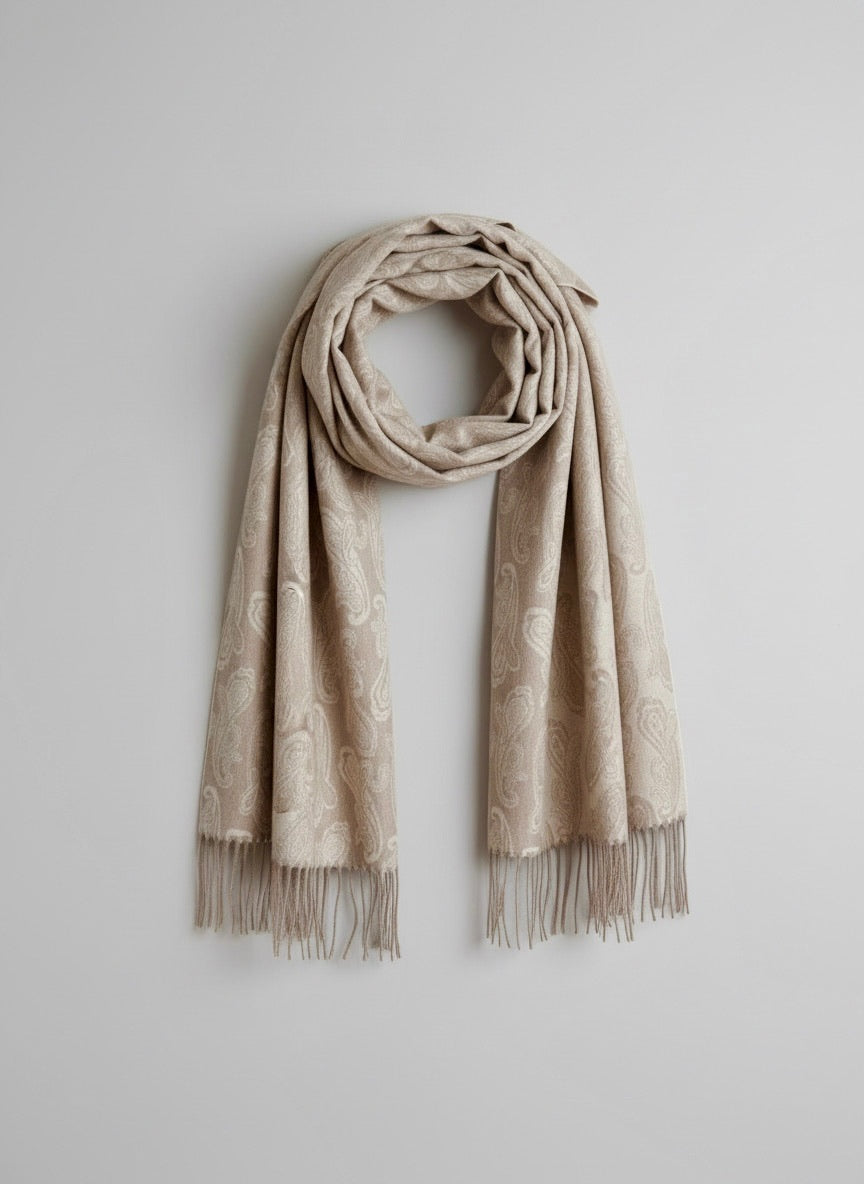 Studio packshot of a pure cashmere paisley scarf in elegant taupe. The scarf is styled with a loose circular drape at the top and straight hanging ends.  showcasing Duo Plus craftsmanship.