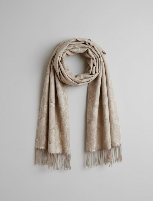 Studio packshot of a pure cashmere paisley scarf in elegant taupe. The scarf is styled with a loose circular drape at the top and straight hanging ends.  showcasing Duo Plus craftsmanship.