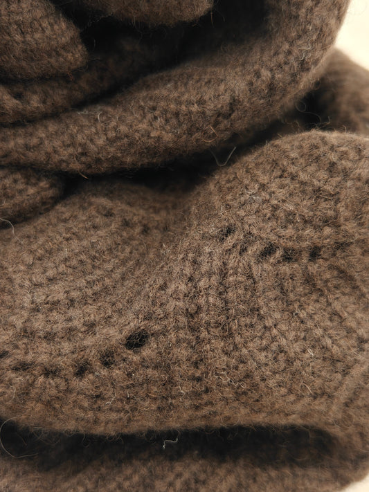 Close up of the brown yak wool blend shawl showing its airy knitted pattern, soft loft, and natural fibers. Highlights the lightweight warmth and handcrafted texture.