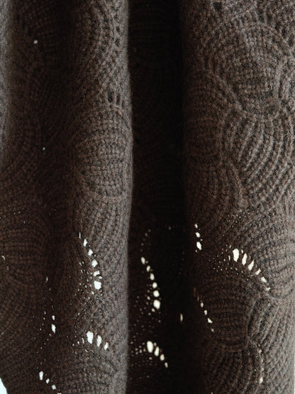 Hanging view of the yak wool shawl showing the natural movement and open knit texture. Soft, breathable, and richly colored for everyday styling.