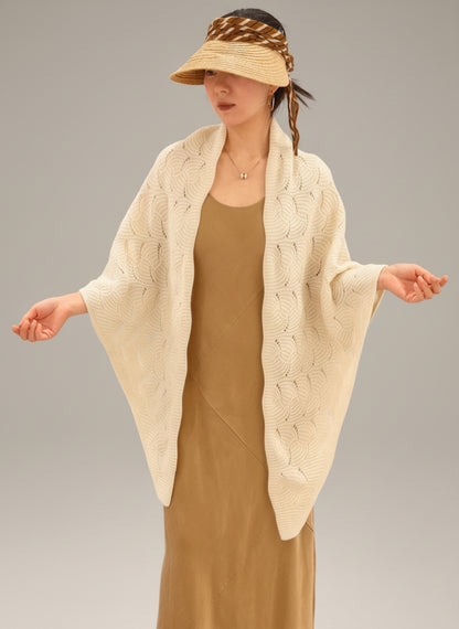 Ivory yak wool blend shawl styled on model, demonstrating size, drape, and elegant open knit texture.